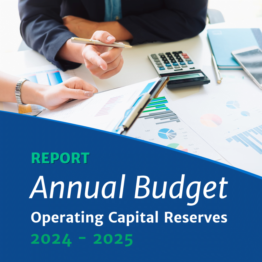 Photo of two people at a table with a calculator going over a budget document with text that reads " Annual Budget: Operating Capital Reserves. 2024-2025 Report"